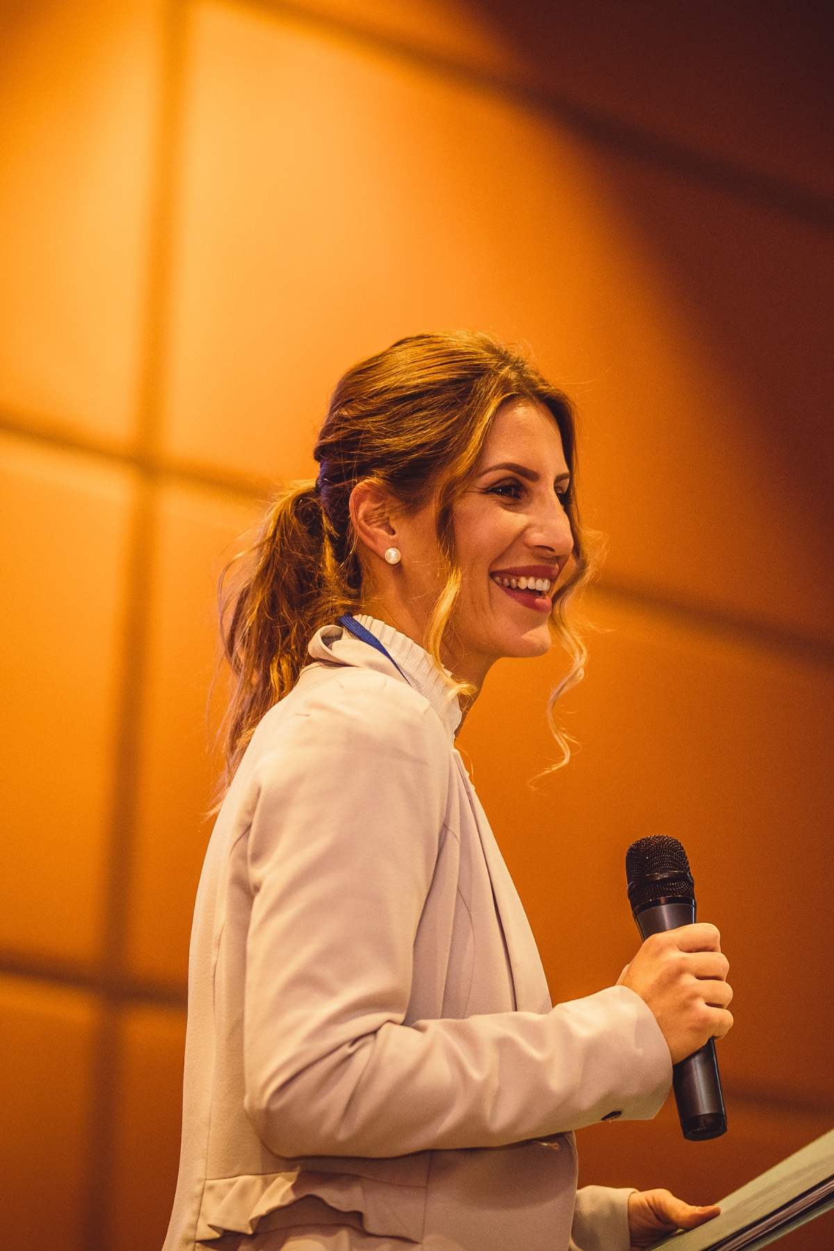 woman speaker with microphone